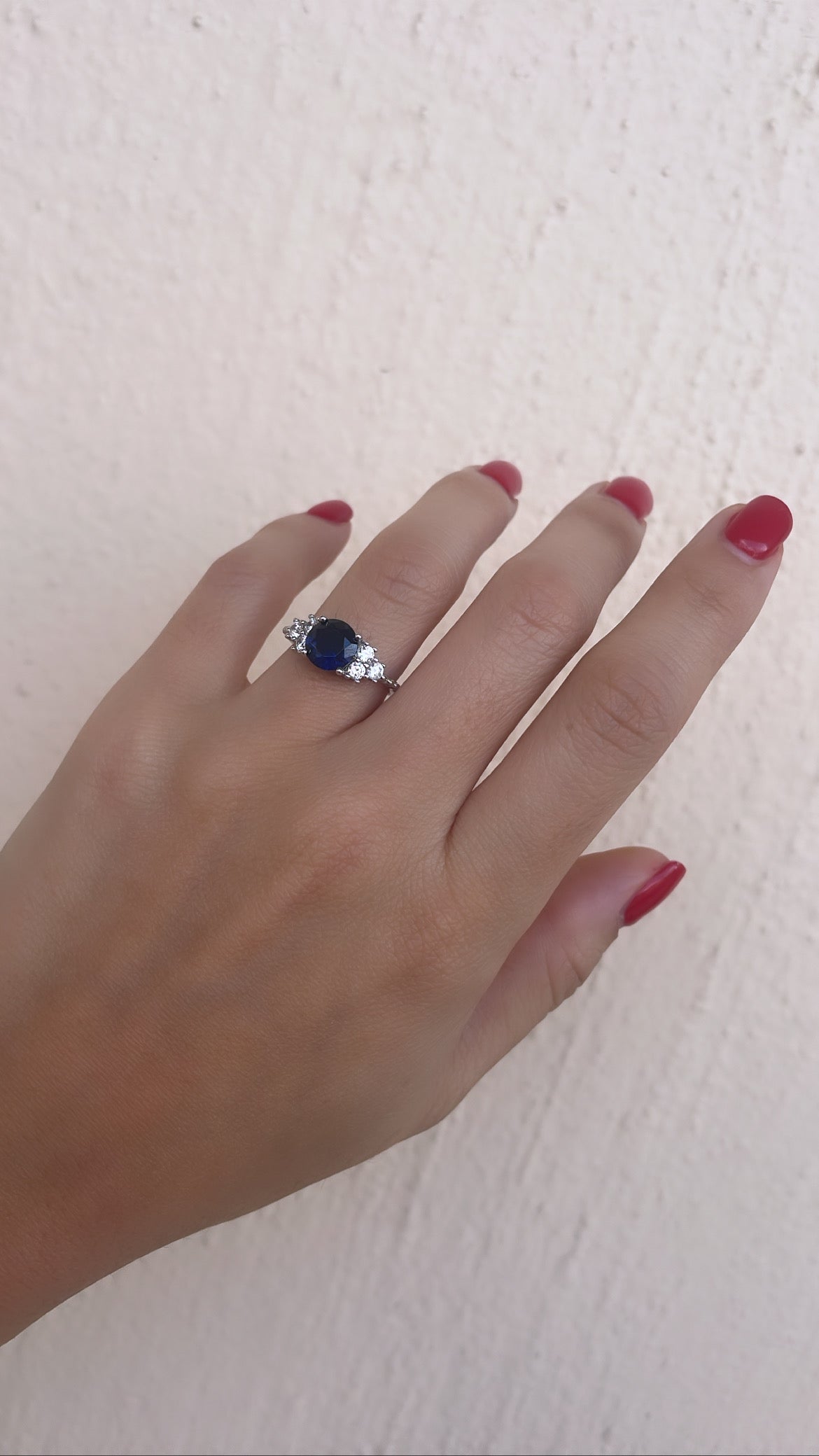 Round Cut Dark Blue Stone With 3 Side Stone Ring