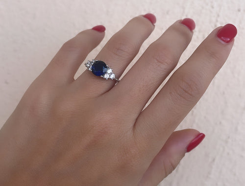 Round Cut Dark Blue Stone With 3 Side Stone Ring